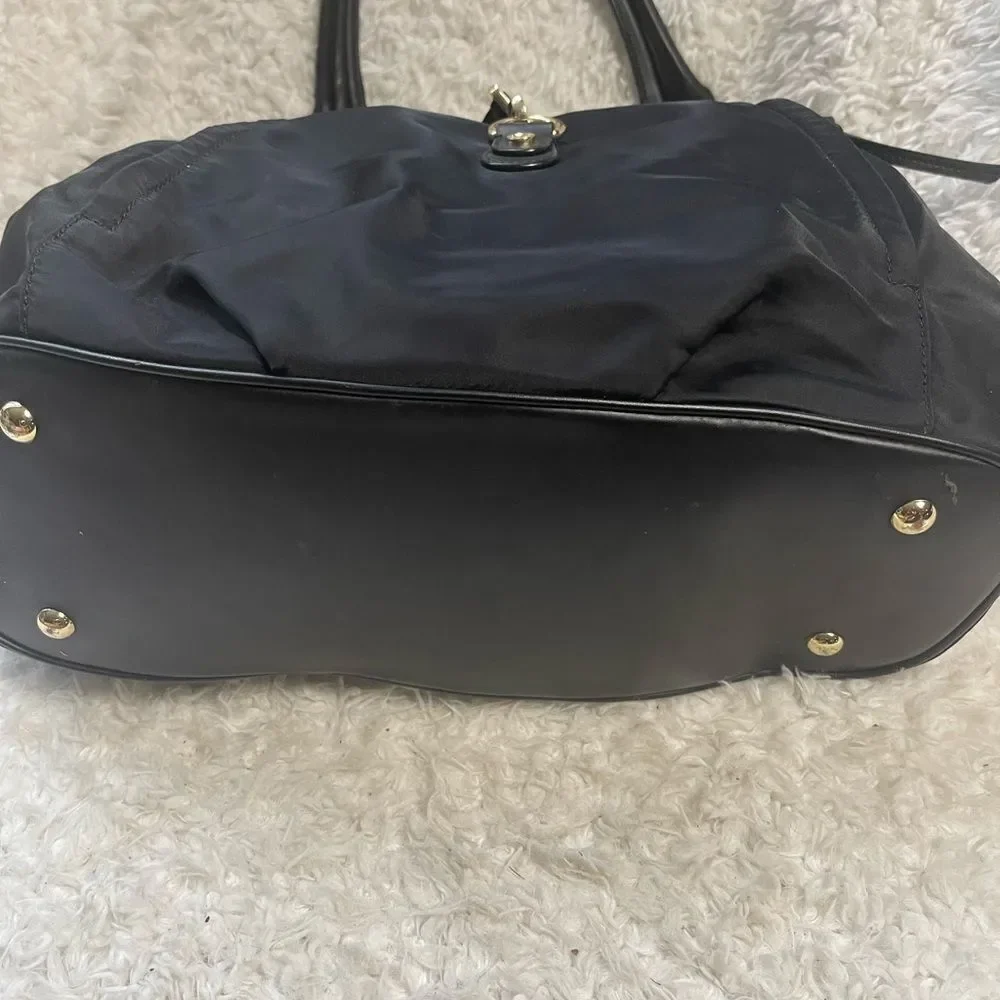 Calvin Klein Black Nylon large shoulder bag with gold tone hardwares.